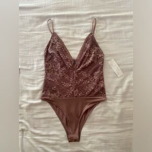 Deep V Lacey bodysuit -Urban Outfitters “Out from under”